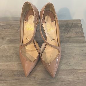 Nude Christian loubotin heels.